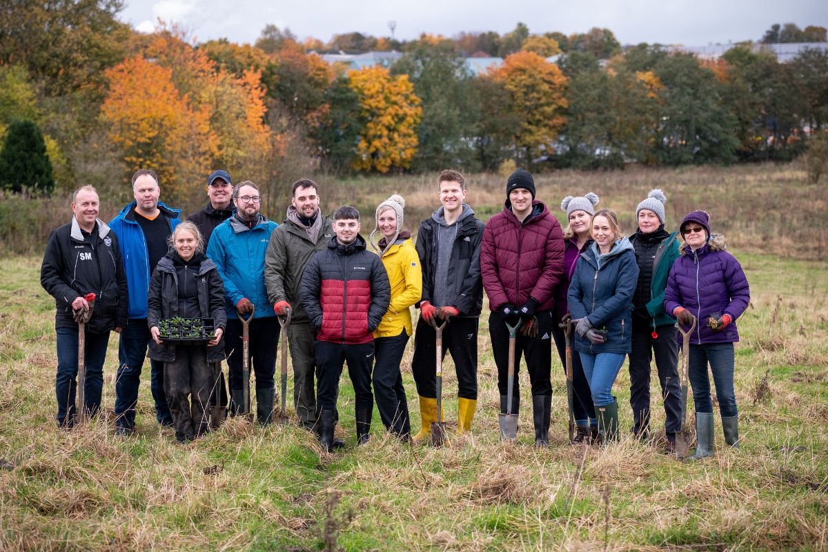 Members of the Commercial and Intermediary team spending their community day planting trees with Cumbria Wildlife Trust