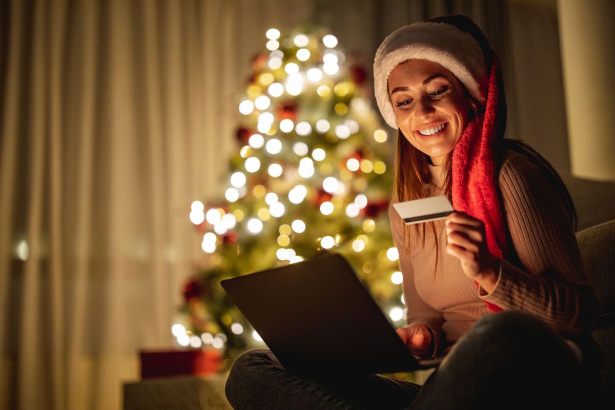 Christmas shopping at home in front of a Christma tree