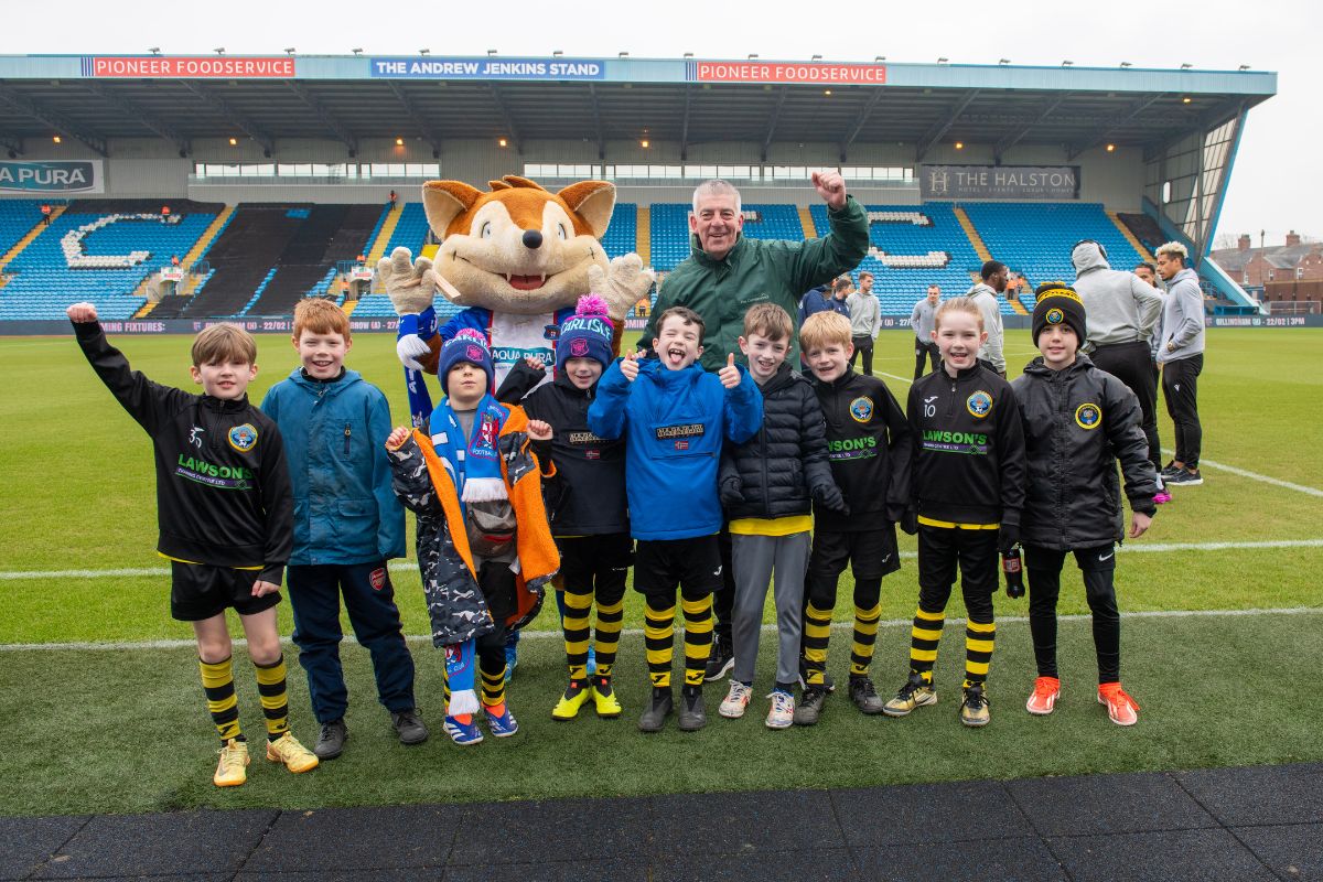 Young Carlisle United fans enjoying a tour of Brunton Park