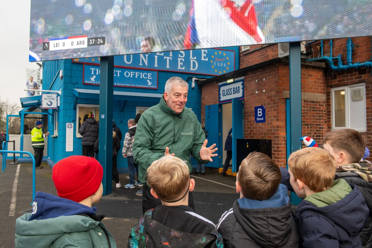 Andrew Gordon with young Carlisle United fans at the match against Colchester United.