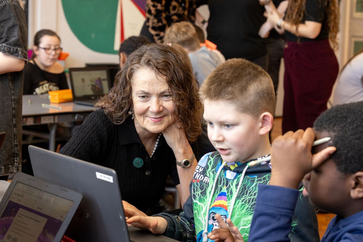 Jackie Arnold, chair of The Cumberland's board, with a pupil from St Cuthbert's Catholic School